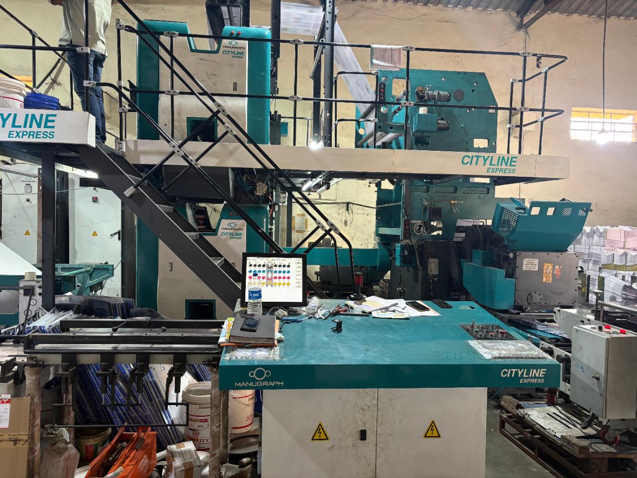 The Manugraph Cityline Express web offset press, control desk in the foreground.